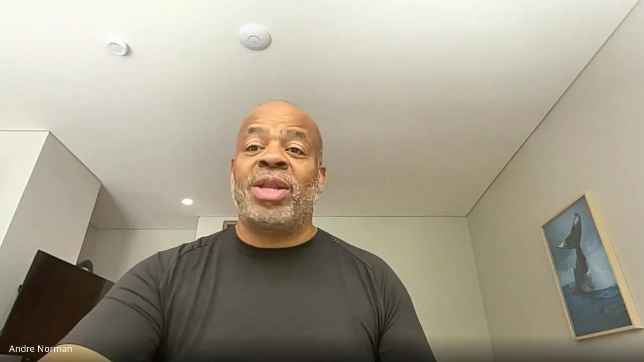 Andre Norman speaking to camera